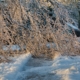 Icy and slippery sidewalk is blocked by fallen frozen tree that was damaged
